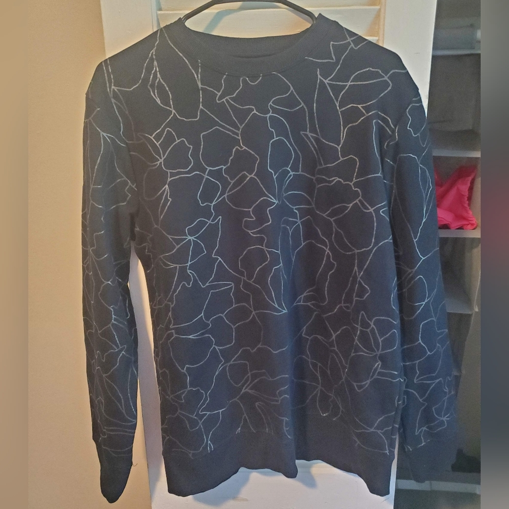 Black sweater with silver floral outlines
